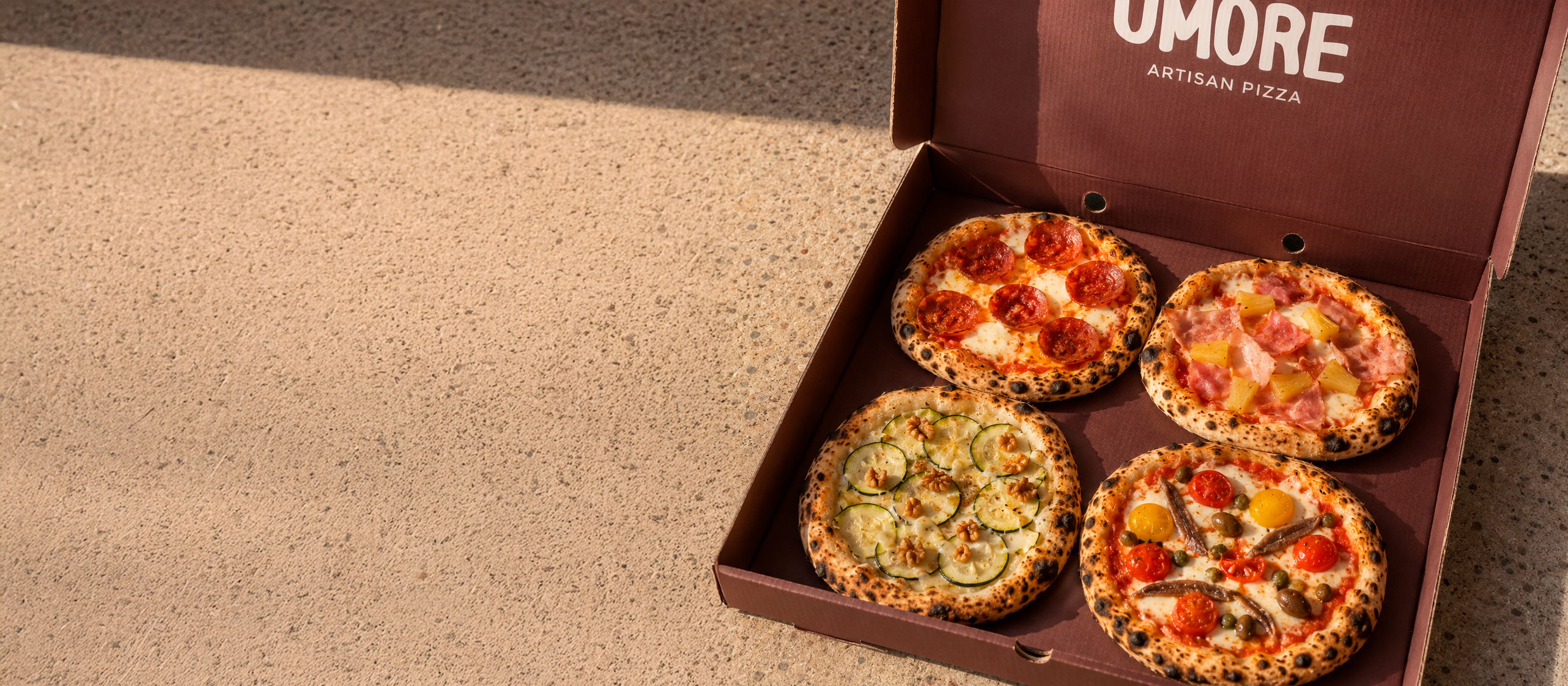 Caja de Umore Bites con cuatro mini pizzas